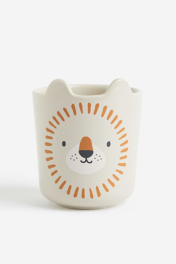 Taza de porcelana con motivo
