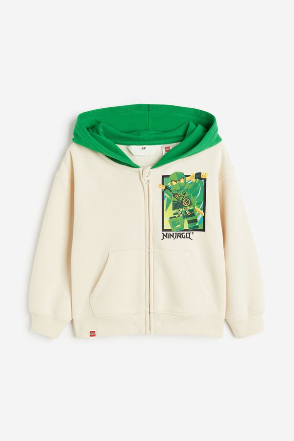 Polerón hoodie con cierre y motivo estampado