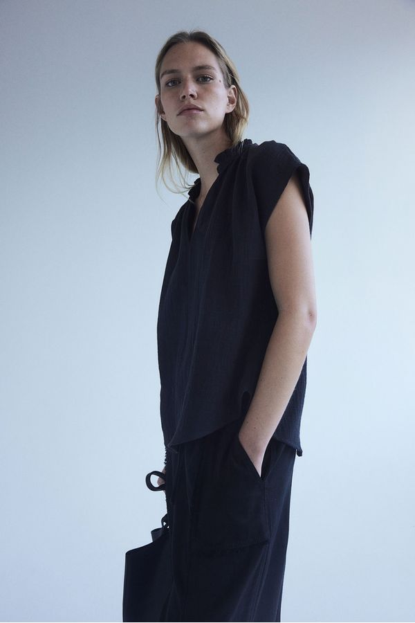 Blusa de algodón con ribete de vuelos