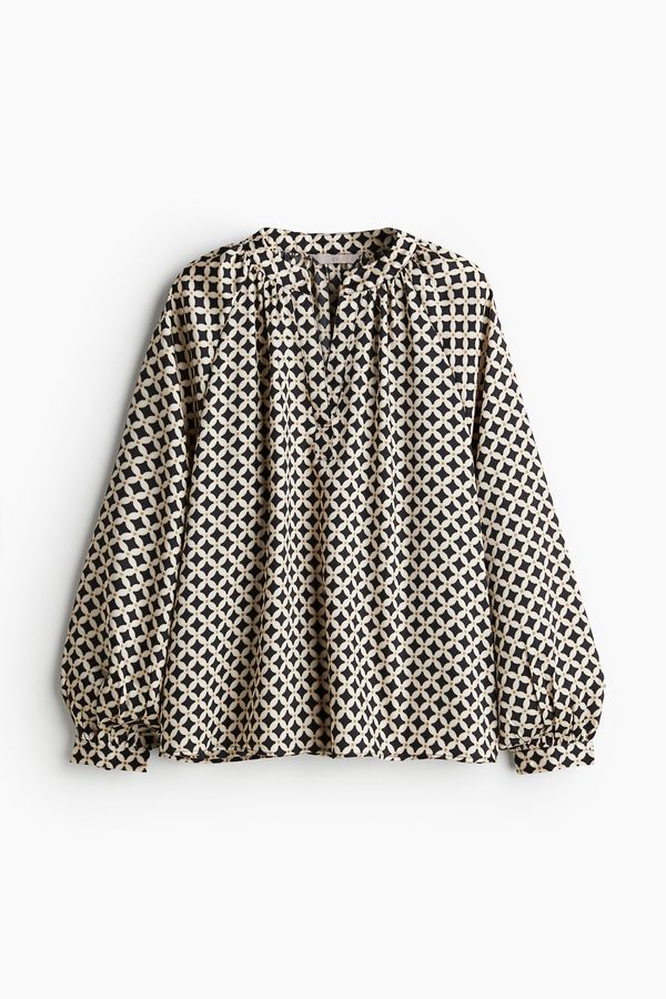Blusa con mangas globo