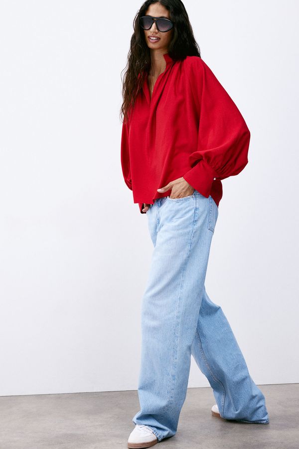 Blusa con mangas globo