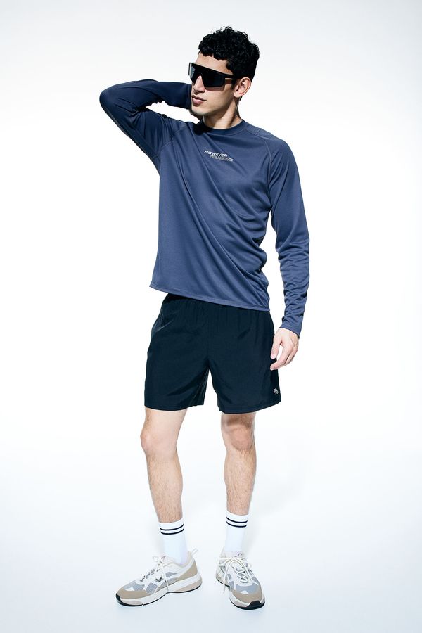 Shorts deportivo a media pierna en DryMove™