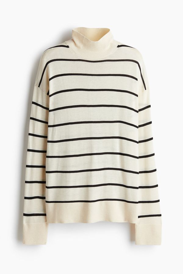 Sweater de punto fino con cuello alto