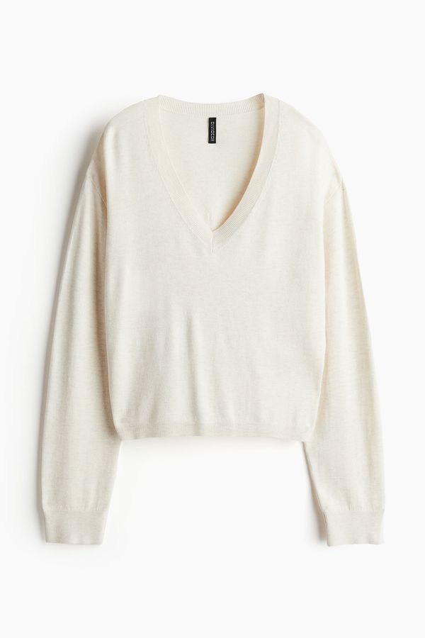 Sweater en punto fino con escote en V