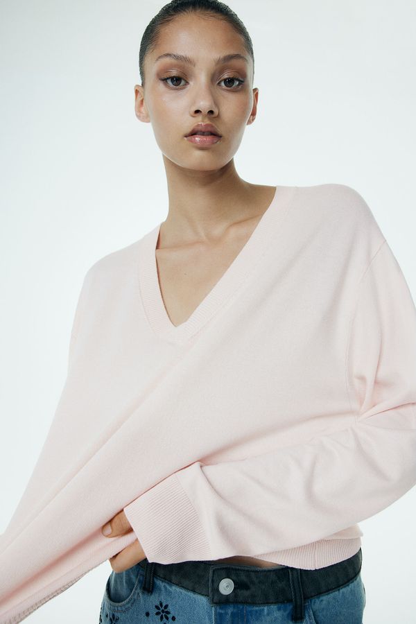 Sweater en punto fino con escote en V