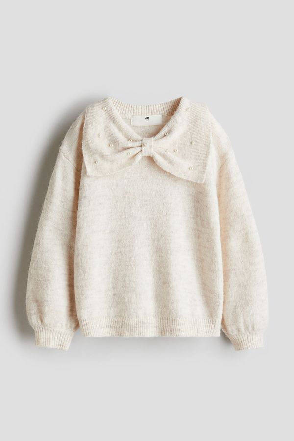 Sweater con detalles decorativos