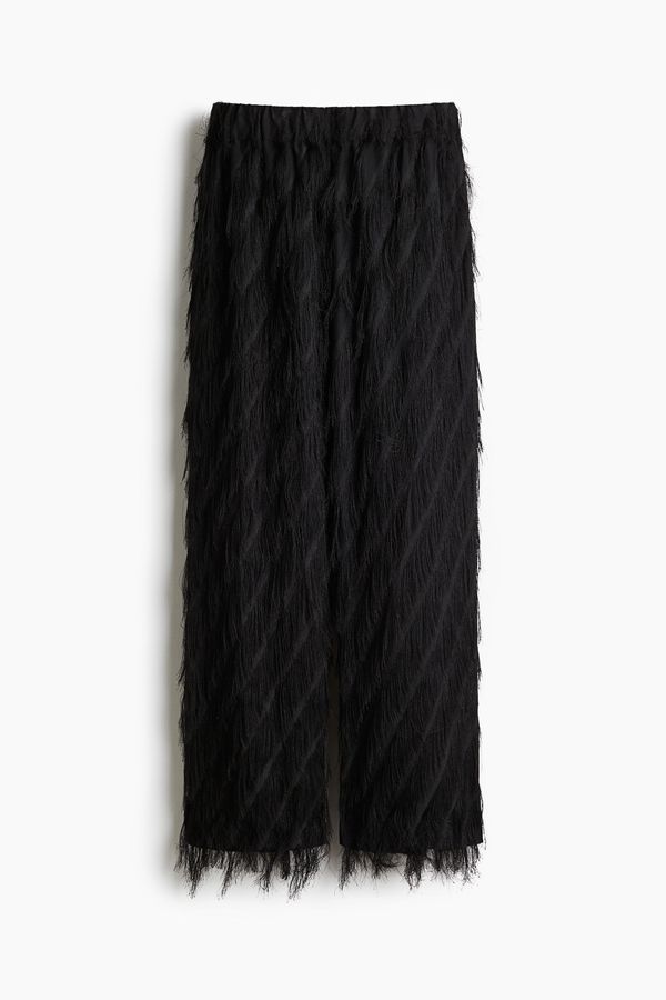 Pantalón con flecos