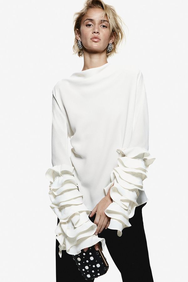 Blusa con mangas de vuelos