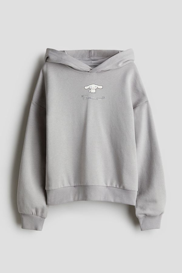 Polerón oversize con capucha y motivo estampado