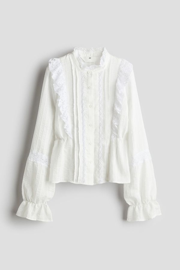 Blusa con inserciones de encaje