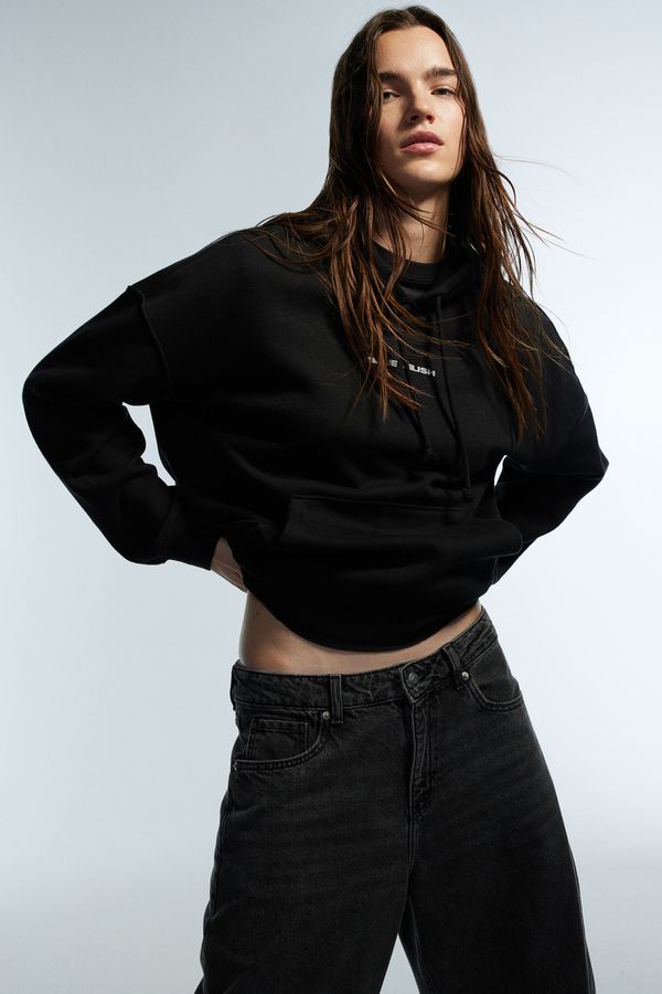 Polerón hoodie oversize con motivo estampado
