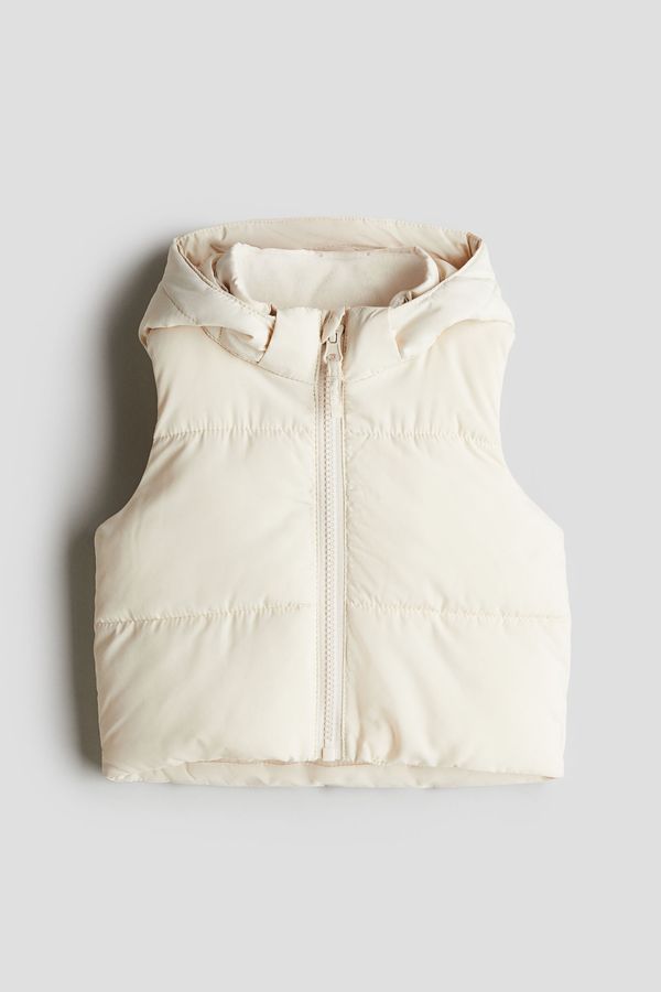 Parka puffy sin mangas con capucha
