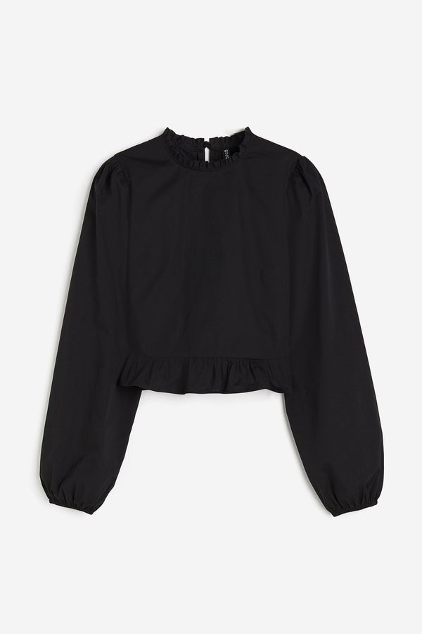 Blusa de mangas globo con peplum