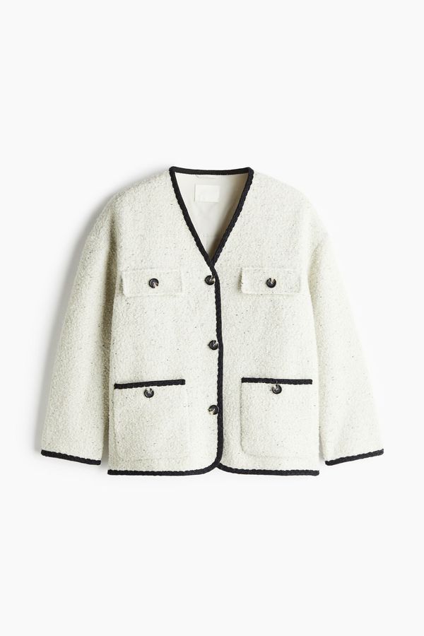 Chaqueta en bouclé con escote en V