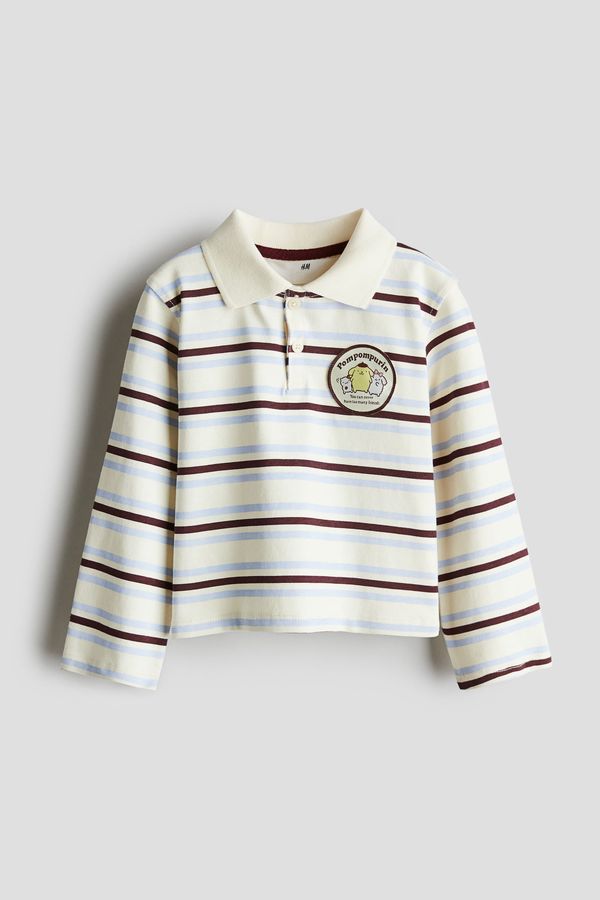 Polera de rugby con aplicación