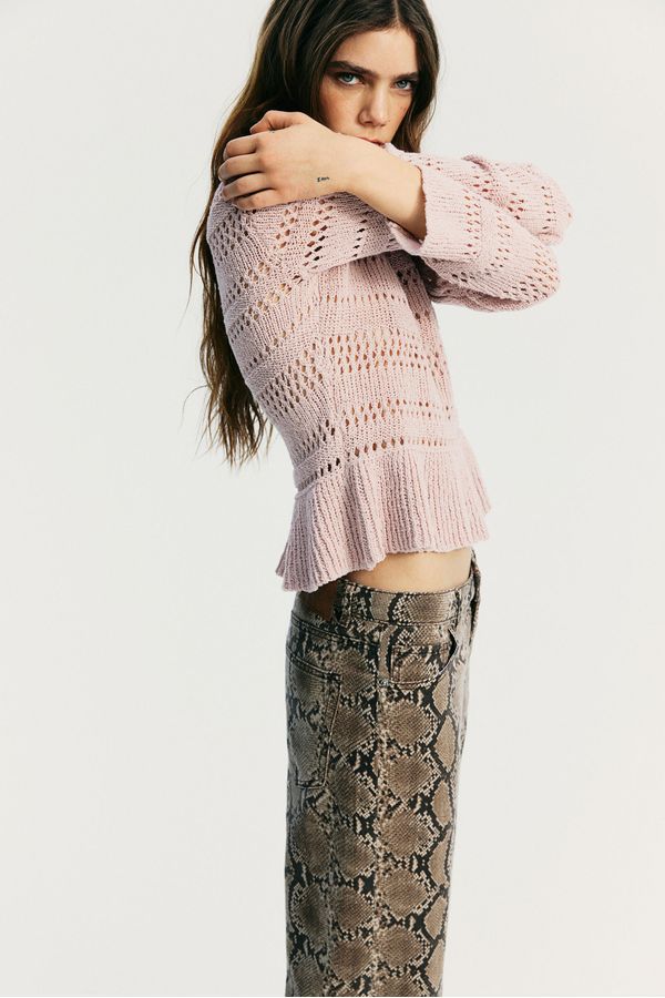 Sweater en punto pointelle con peplum