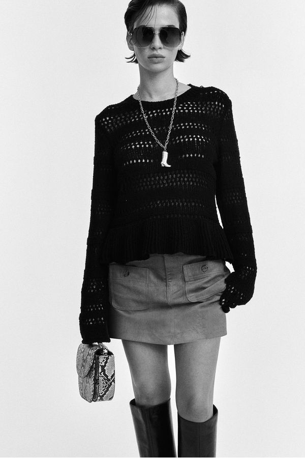 Sweater en punto pointelle con peplum