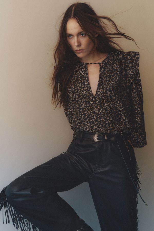 Blusa de vuelos