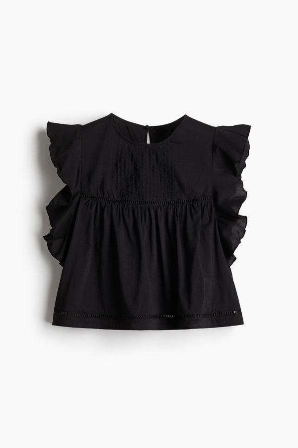 Blusa con mangas onduladas