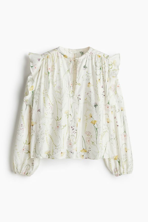Blusa de vuelos