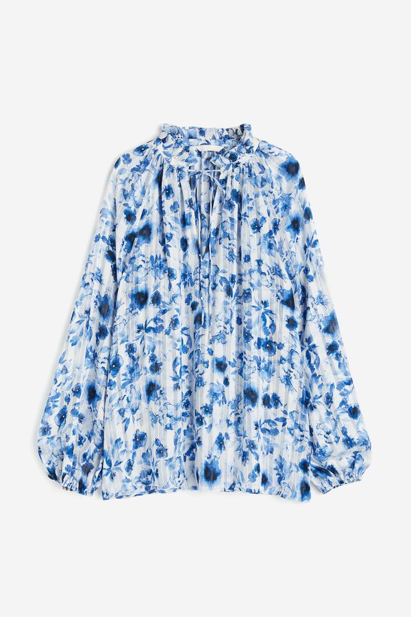 Blusa en tejido crepé con vuelos
