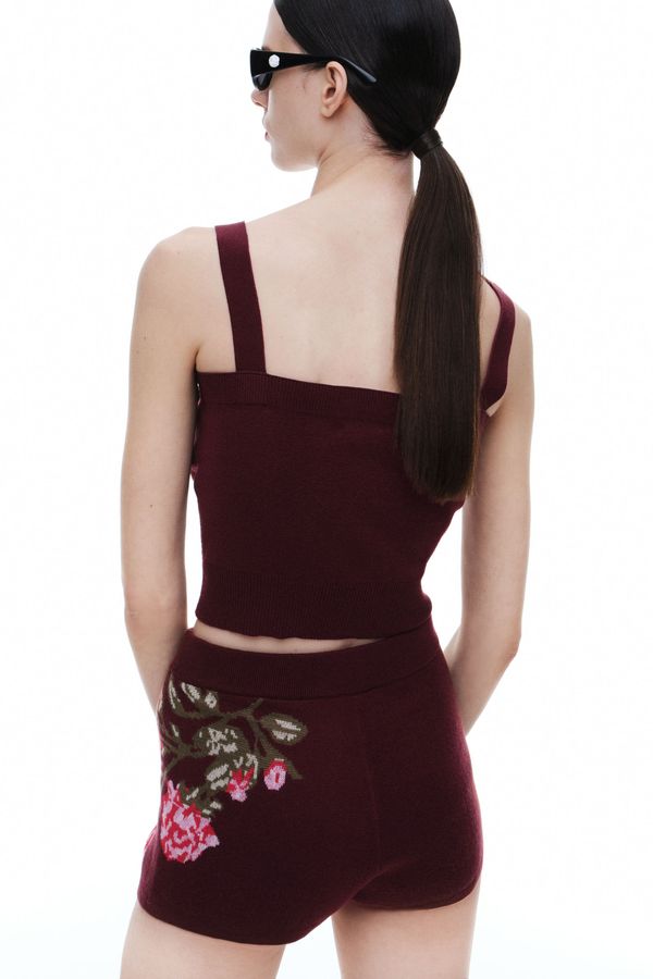 Top de mezcla de lana con aplicaciones de rosa