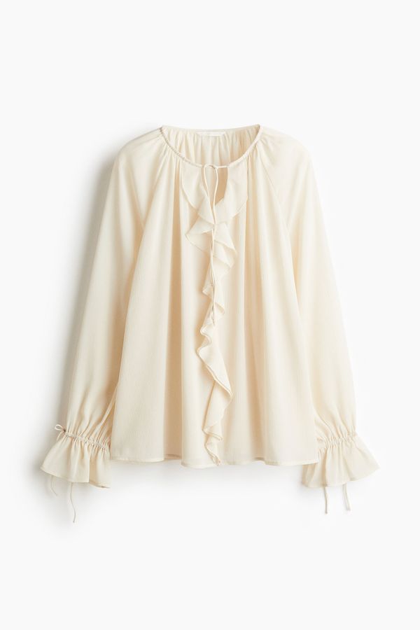 Blusa con ribetes de vuelos