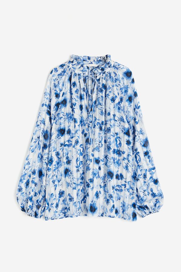 Blusa en tejido crepé con vuelos