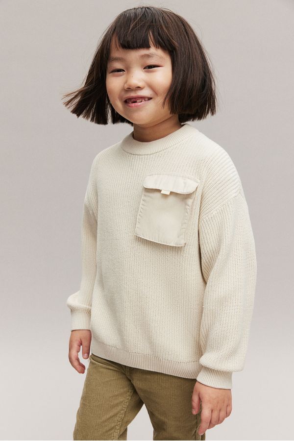 Sweater con bolsillo de solapa