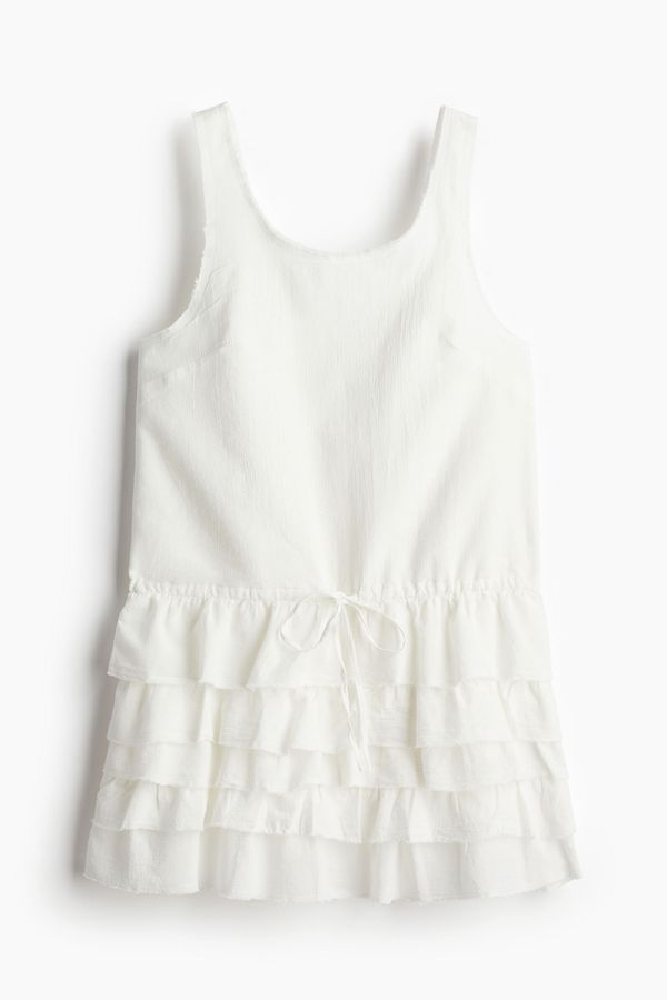 Vestido con falda de vuelos sin rematar