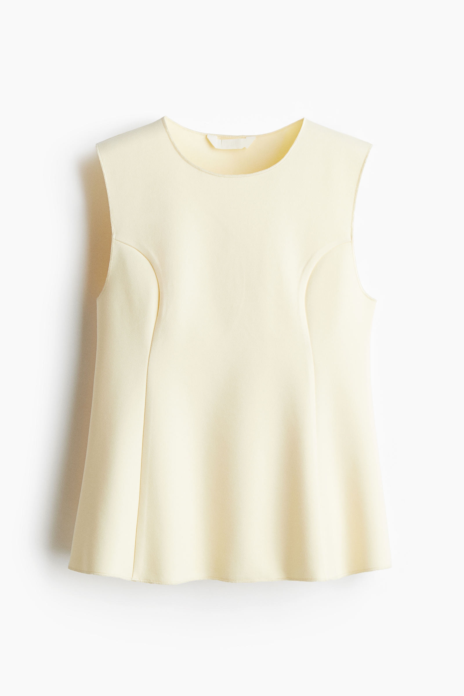 Top interlock con peplum